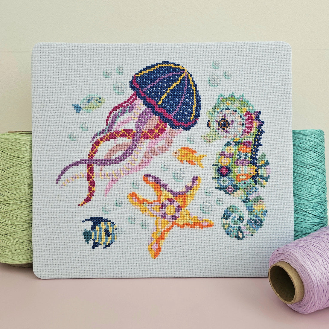 Completed Serene Seas cross stitch collection with matching needle minder from the Meloca Stitch Circle subscription