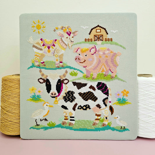 Farmyard Finds Meloca Stitch Circle cross stitch subscription design featuring colourful cow, pig and goat designs